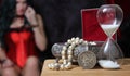 Vintage Jewelry Box with hourglass and Silver Dollar woman in corset in background Royalty Free Stock Photo