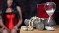 Vintage Jewelry Box with hourglass and Silver Dollar woman in corset in background Royalty Free Stock Photo