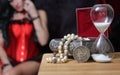 Vintage Jewelry Box with hourglass and Silver Dollar woman in corset in background Royalty Free Stock Photo