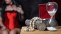 Vintage Jewelry Box with hourglass and Silver Dollar woman in corset in background Royalty Free Stock Photo