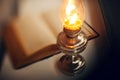 Vintage kerosene lamp and old open book Royalty Free Stock Photo