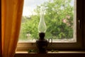 Vintage kerosene lamp on the windowsill Royalty Free Stock Photo