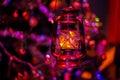 Vintage kerosene lantern Christmas night and bright blurred beautiful background with bokeh. Soft focus.