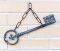 Vintage key on brick wall background, home decor Royalty Free Stock Photo