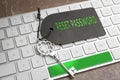 Vintage key with tag on laptop, closeup. Password security concept