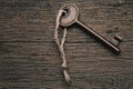 Vintage key on a wold wooden surface Royalty Free Stock Photo