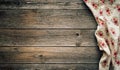 Vintage kitchen tablecloth on rustic wooden table made of rough old wood planks. Textured background with copy space. Royalty Free Stock Photo