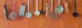 Vintage kitchen utensils,food and drink and kitchen concept, nostalgic items hanging on orange background,panoramic,free copy Royalty Free Stock Photo