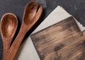 Vintage kitchen wooden utensils with chopping board on stone table background. Top view. Space for text Royalty Free Stock Photo