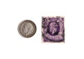 Vintage kKng George V coin and postage stamp from the United Kingdom.