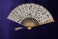 Vintage Lace Hand Fan On Purple Velvet Background Royalty Free Stock Photo