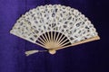 Vintage Lace Hand Fan On Purple Velvet Background Royalty Free Stock Photo