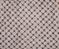 Vintage Lace or Netting that is black and brown and covering full frame of white boards background.  Horizontal that can be vertic Royalty Free Stock Photo