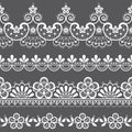 Vintage lace seamless vector pattern, ornamental repetitive design with flowers and swirls in white on gray background Royalty Free Stock Photo