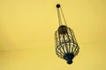 vintage lamp hanging from the ceiling with modern yellow interior room. Royalty Free Stock Photo