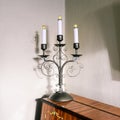 Vintage lamp with light bulbs stands on the piano. Decorative element of the interior. The design element of the room. Royalty Free Stock Photo