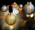 Vintage lamp or Modern Light bulb hang on ceiling in bokeh background. Royalty Free Stock Photo