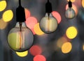 Vintage lamp or Modern Light bulb hang on ceiling in bokeh background. Royalty Free Stock Photo