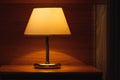 Vintage lamp on night table in hotel room Royalty Free Stock Photo