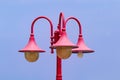 Vintage lamp post side street. Old red lamp beautiful blue-sky background. Royalty Free Stock Photo