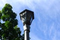 Vintage lamp streetlight stand strong in the middle of noon