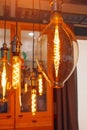 Vintage lamps with a luminous LED spiral in the form of bulbs, ovals and drops in a retro interior