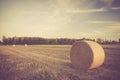 Vintage landscape of straw bales on stubble field Royalty Free Stock Photo