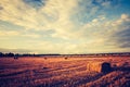 Vintage landscape of straw bales on stubble field Royalty Free Stock Photo