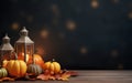 Vintage lantern with burning candle on wooden floor decorated in autumnal style, pumpkins, maple leaves. Blurred bokeh lights. Royalty Free Stock Photo