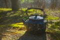 Vintage large aluminum tea pot kettle stove on nature background. Old tea pot Royalty Free Stock Photo