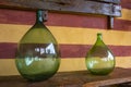 Vintage large wine bottles. Wine cellar, storage of wine. Royalty Free Stock Photo