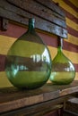 Vintage large wine bottles. Wine cellar, storage of wine. Royalty Free Stock Photo