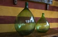 Vintage large wine bottles. Wine cellar, storage of wine. Royalty Free Stock Photo