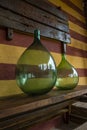 Vintage large wine bottles. Wine cellar, storage of wine. Royalty Free Stock Photo