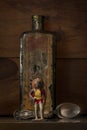 Vintage lead Native American figue with medicine bottle and silver spoon