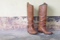 Leather boots,knee-high boots,leather, bohemaiam boots,bohemian,cowboy,cowgirl,leather shoe,woman boots,brown boots Royalty Free Stock Photo