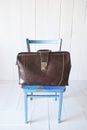 Vintage leather briefcase on chair