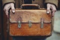 Vintage leather briefcase held by hands Royalty Free Stock Photo