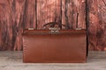 vintage leather carpetbag on wooden Royalty Free Stock Photo