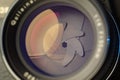 Vintage lens front element close up macro shot with light reflections and visible closed  aperture blades Royalty Free Stock Photo