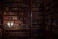 Vintage library background, bookcase and shelves with old books, antique shop