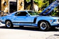 Bright Blue Vintage Ford Mustang With Black Racing Stripes