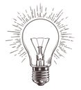 Vintage light bulb in engraving style. Hand drawn retro lightbulb with illumination for idea concept. Vector