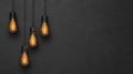 Vintage light bulbs hanging against a dark background Royalty Free Stock Photo