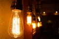 Vintage light Edison bulbs. Lighting decor concept. Golden shining antique. Blur background of retro lights