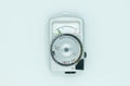 Vintage light meter on white background Royalty Free Stock Photo