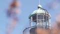 Vintage lighthouse tower, retro light house, old fashioned beacon, fresnel lens. Royalty Free Stock Photo