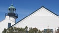 Vintage lighthouse tower, retro light house, old fashioned classic white beacon. Royalty Free Stock Photo