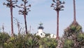 Vintage lighthouse tower, retro light house, old fashioned classic white beacon. Royalty Free Stock Photo