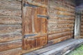 Vintage log warehouse with closed door made of thick boards Royalty Free Stock Photo